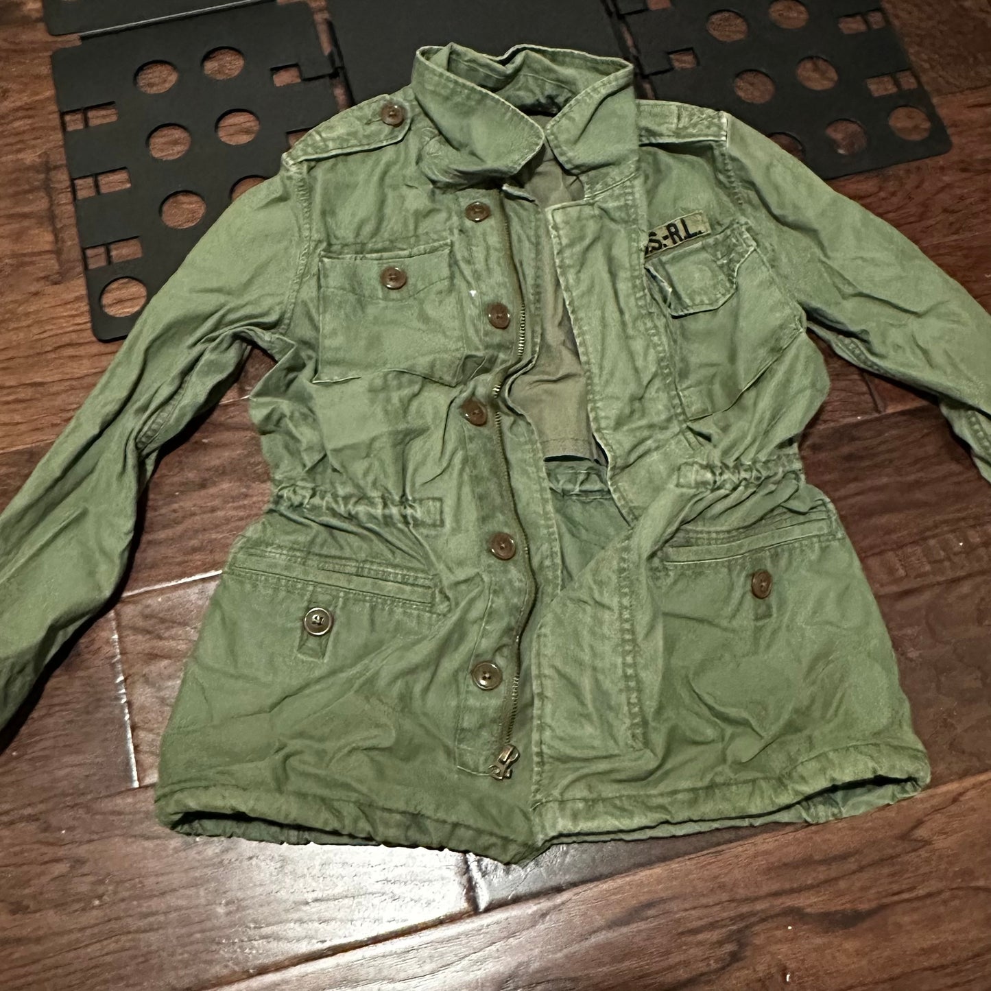 Woman’s olive jacket