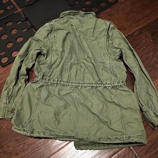 Woman’s olive jacket